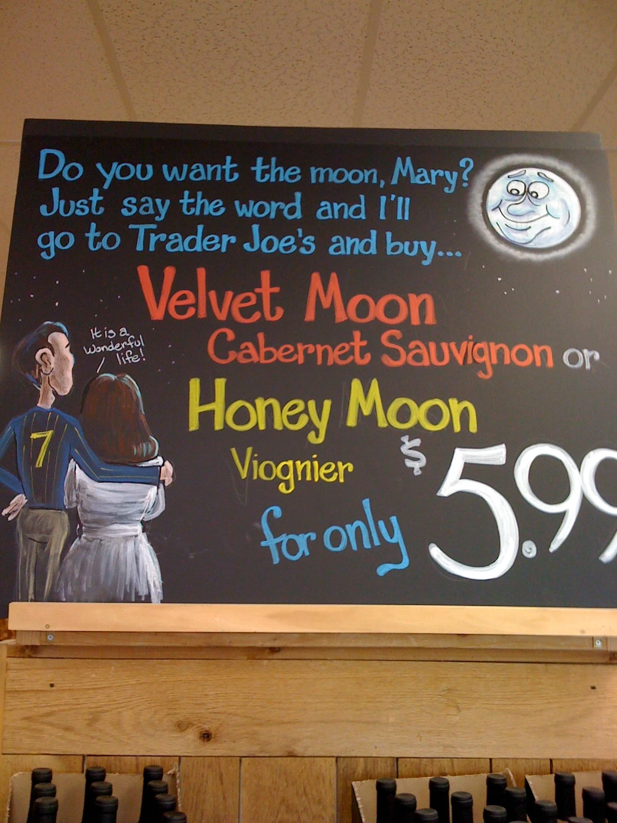 Trader Joe&rsquo;s wine sign. In chalk. Good holiday theme. Pretty good artist, huh?