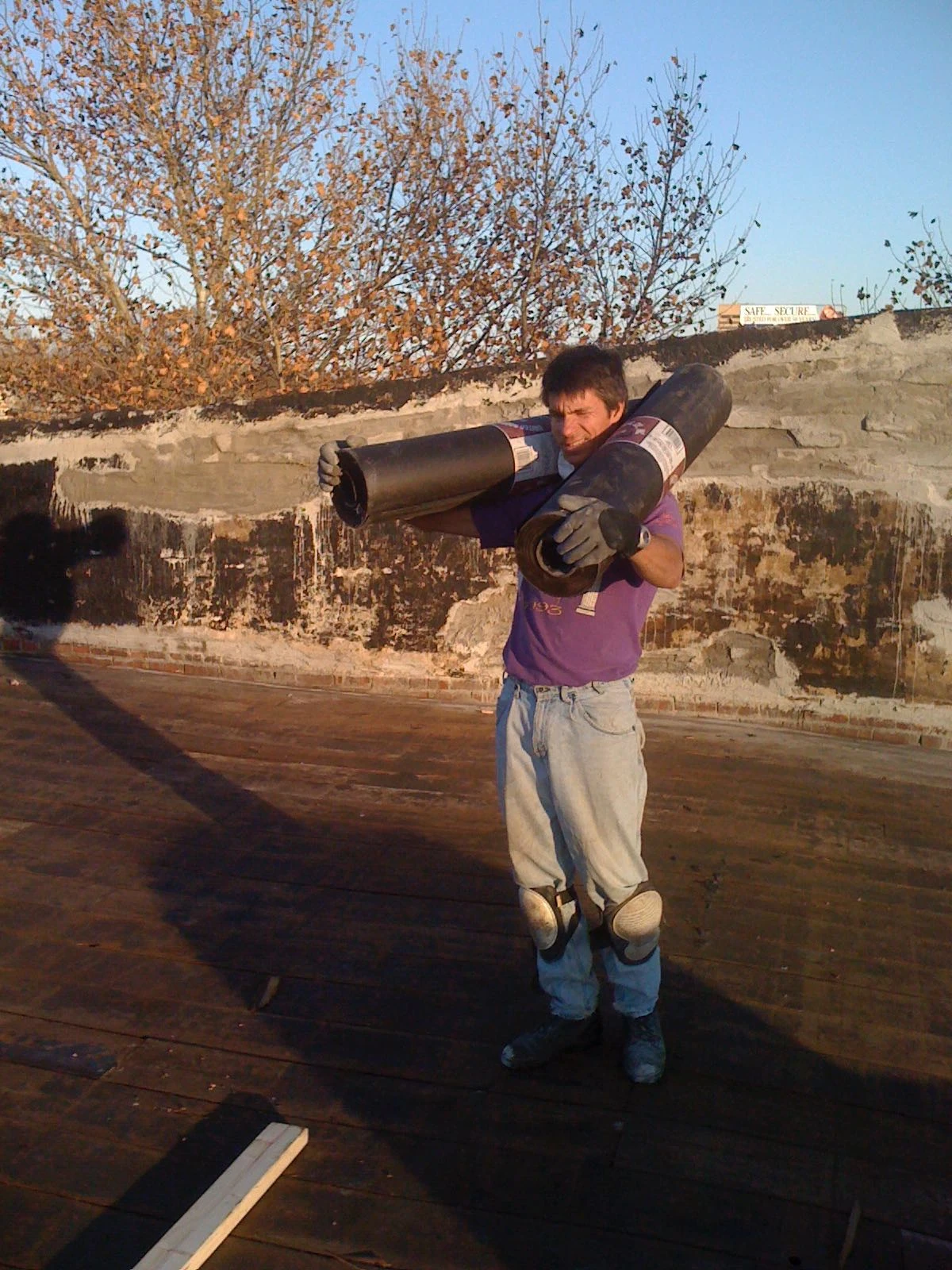 Bill carrying roofing felt.