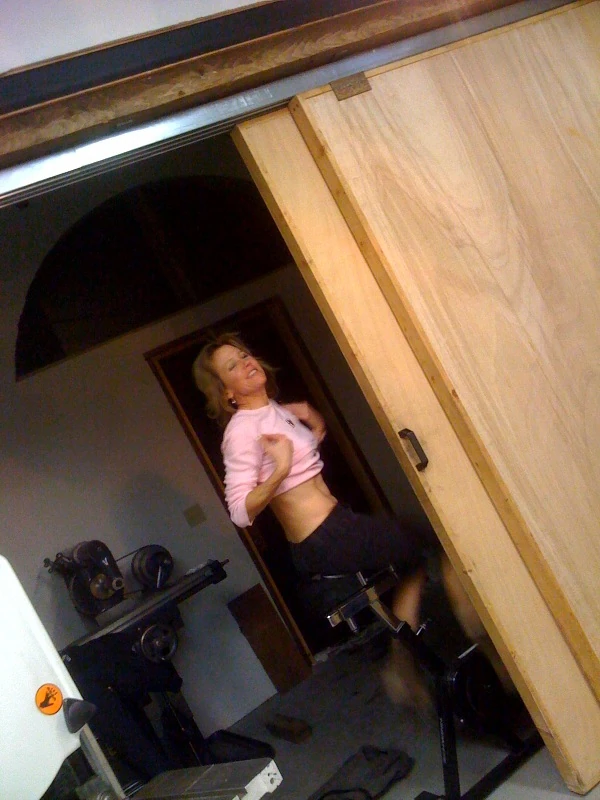 photo-6 Catherine trying to burn off some extra energy, riding in her UGG boots in the back of Kent’s shop. (She was trying to show off her Eriksen Cycles shirt. )