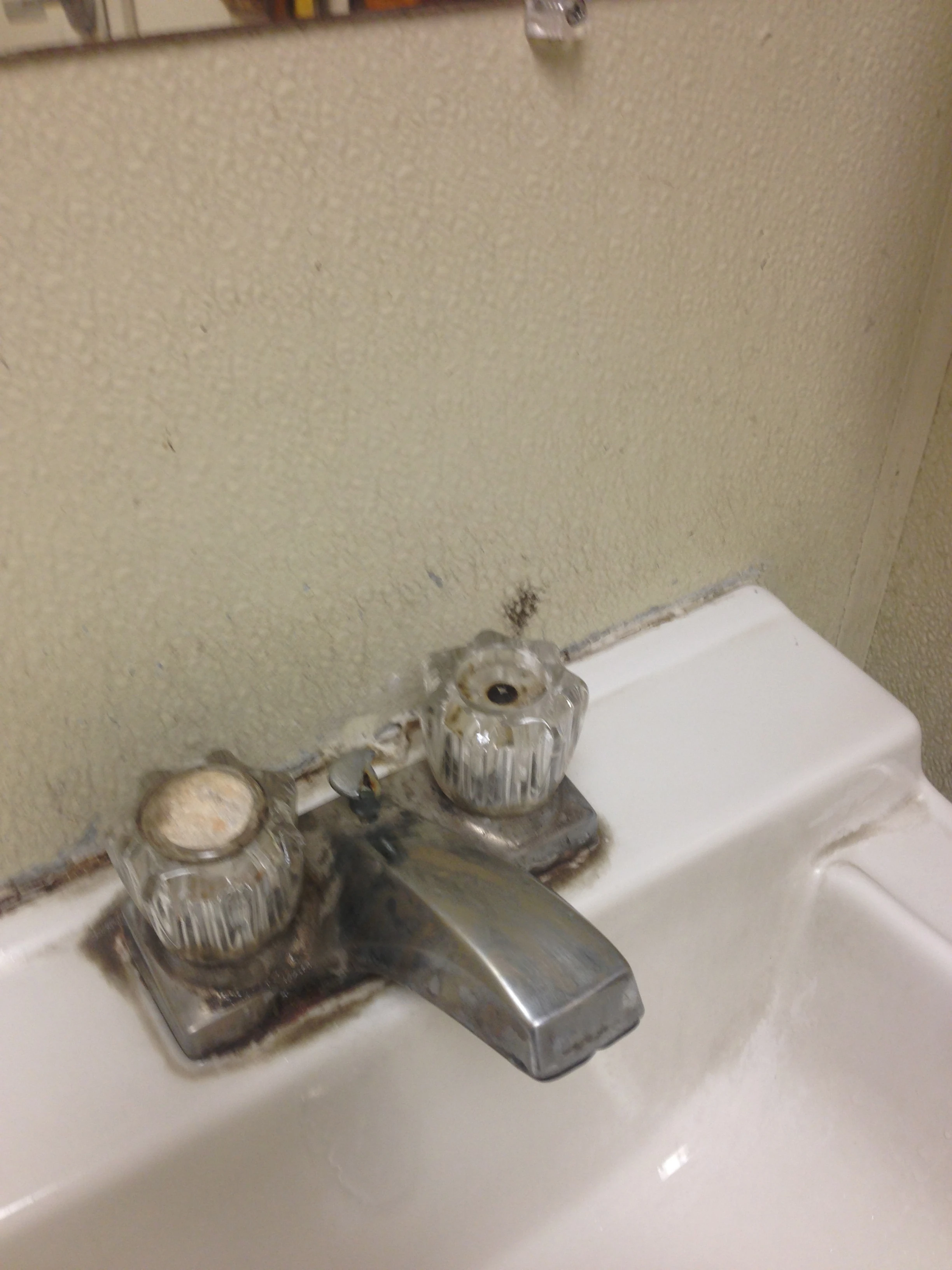 This is at a fuel stop in Iowa on the way up. This is the normal gas station faucet handle. I think there is probably a place that sells them new looking like this just for gas stations. It would cut down on water usage because no one wants to touch them.