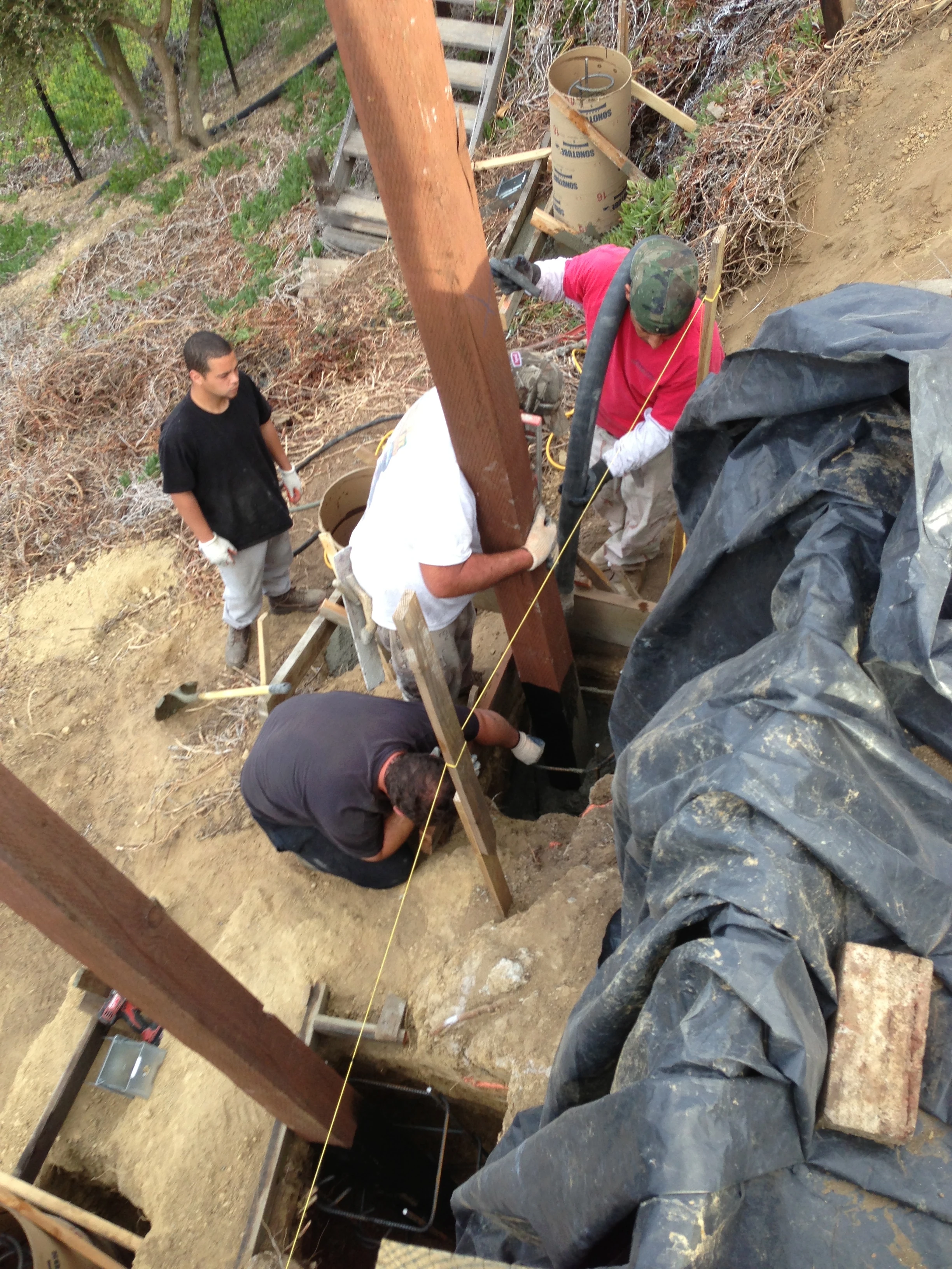 I was woken every morning to these guys who are putting up a new retaining wall in the back. I was itching to help them.