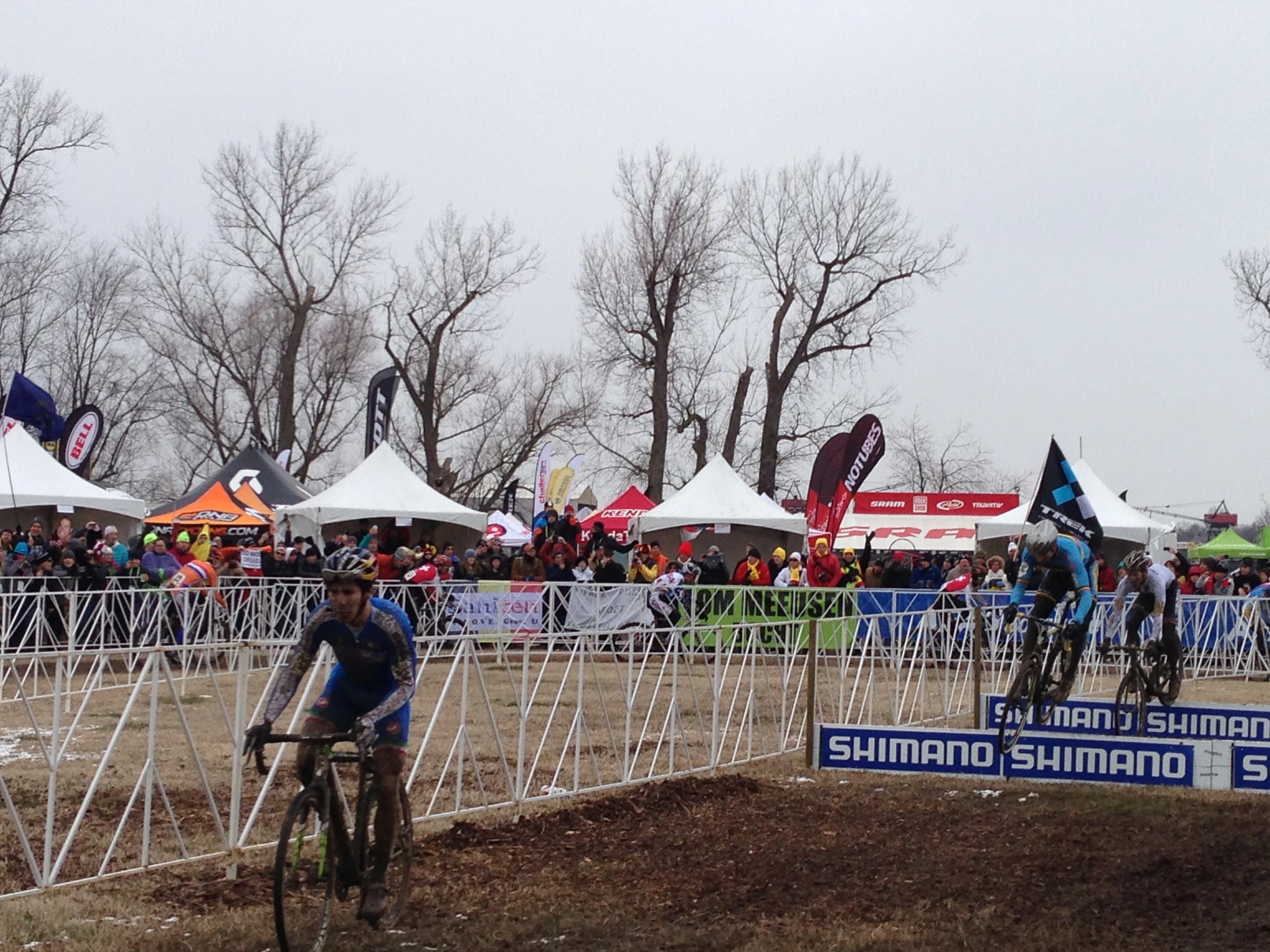Some barriers action the first lap of the Elite race.