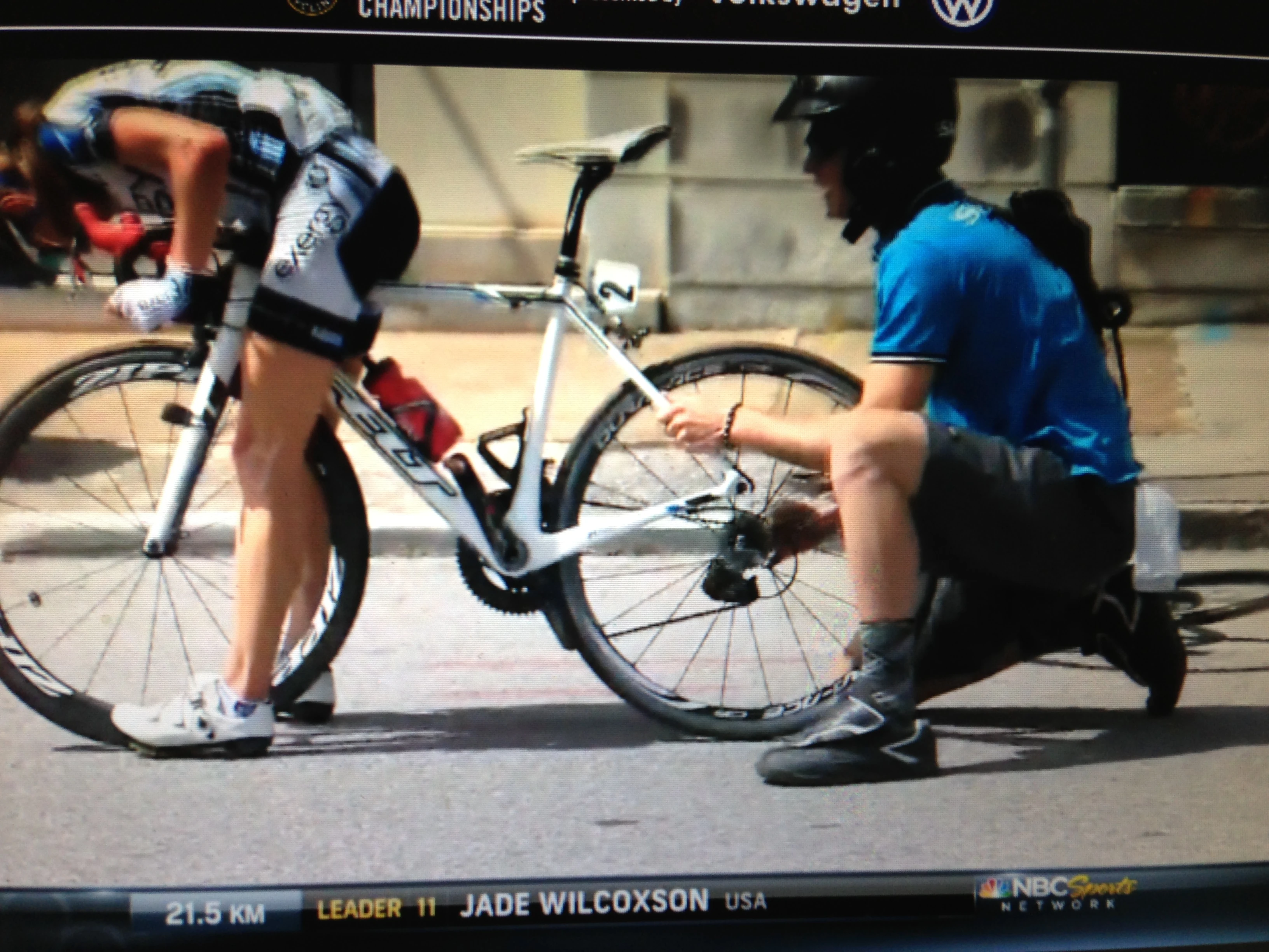 The guy is still trying to put the wheel in with the derailleur in his hand.