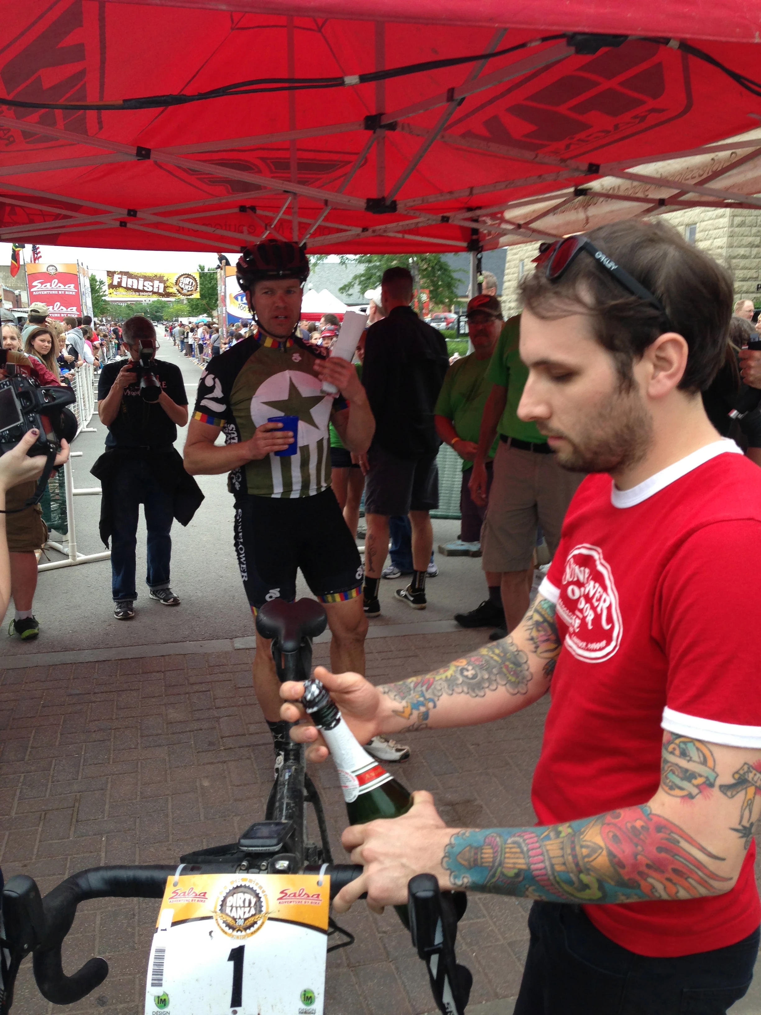 Collin, Dan&rsquo;s support, popping the bubbly right after the finish. Collin was crazy nervous before Dan actually cross the line.