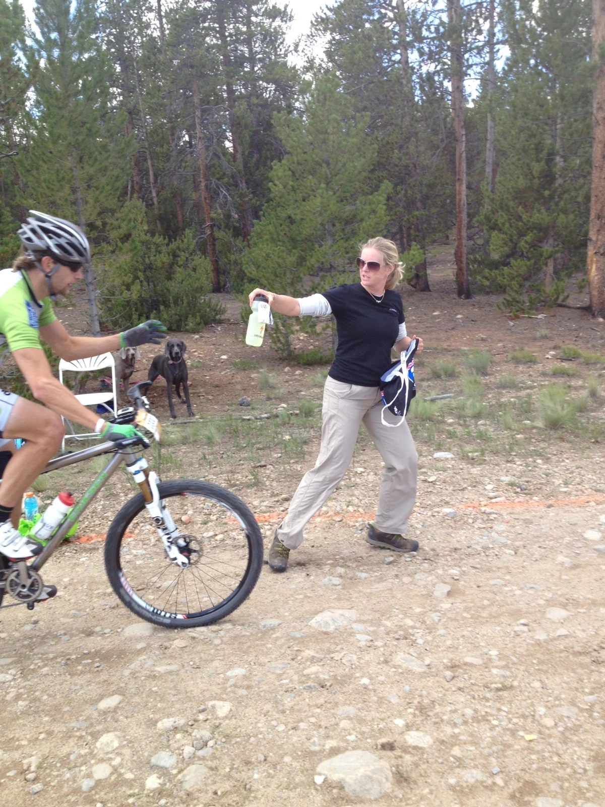Michelle, Brian&rsquo;s wife, feeding him at the last feed zone yesterday. 