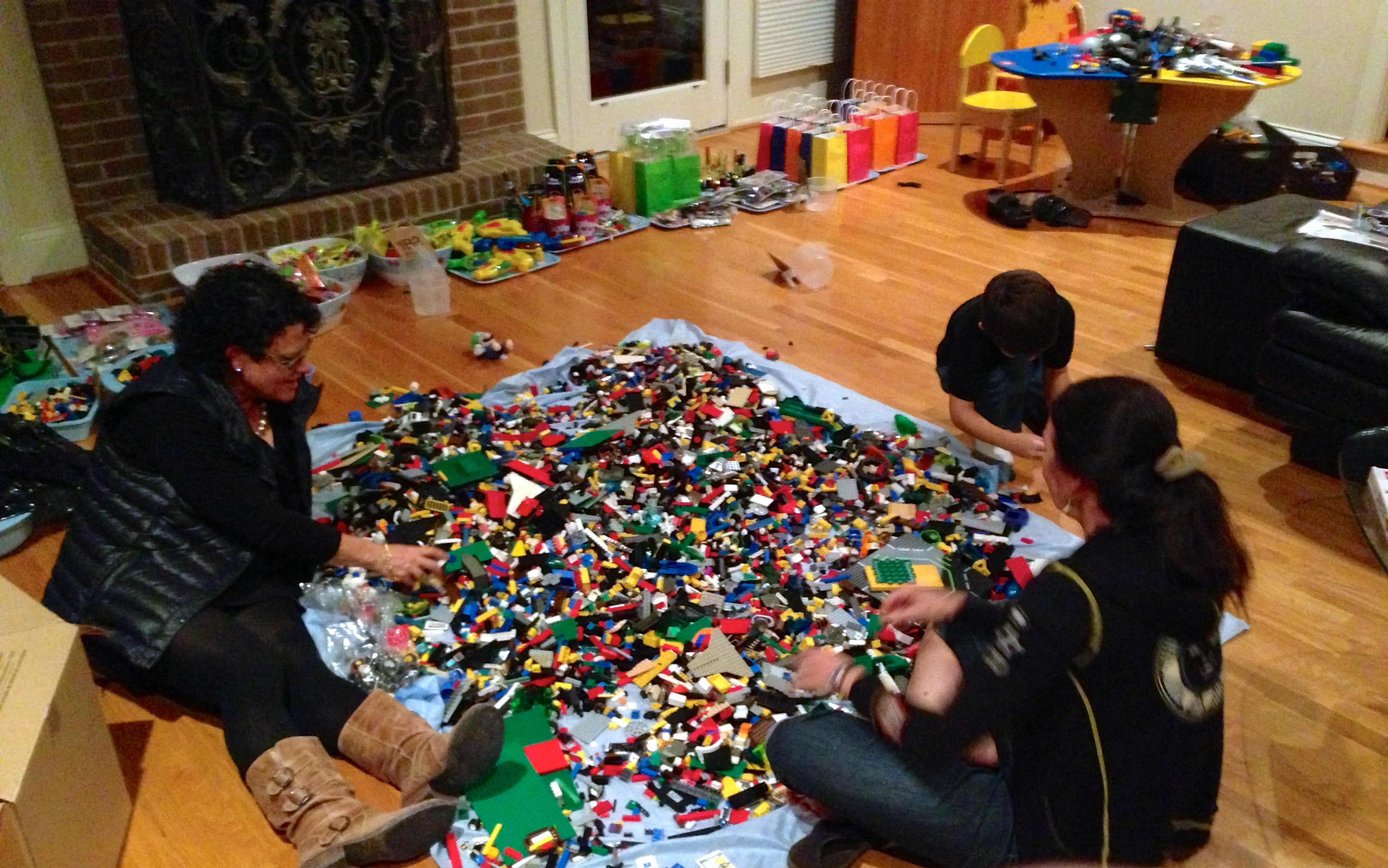 Trudi, Stacie and her son Adam sorting through &ldquo;a few&rdquo; legos for Adam&rsquo;s birthday party this weekend.