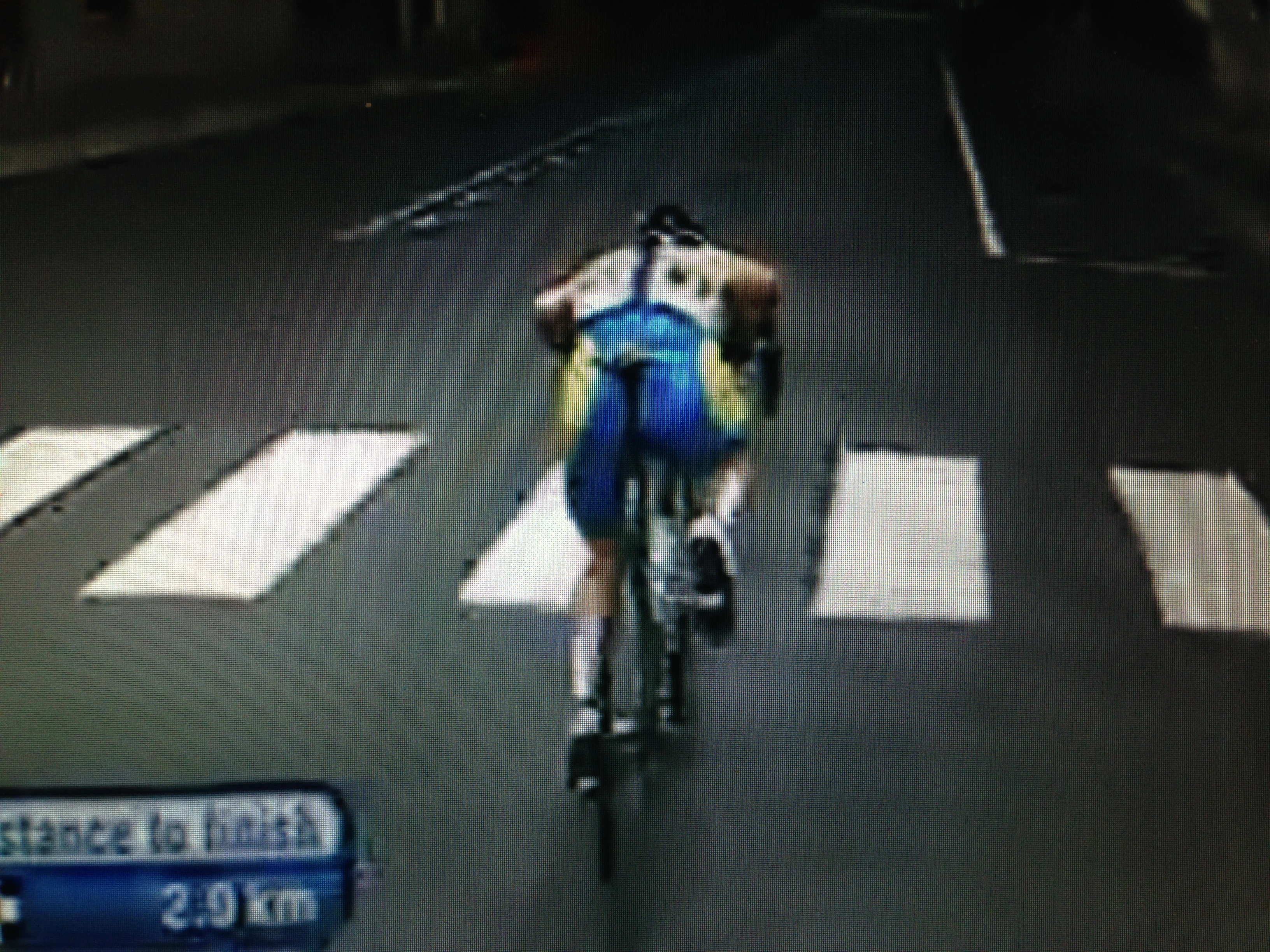 Here he is with less than 2 miles to go in the race doing it again.