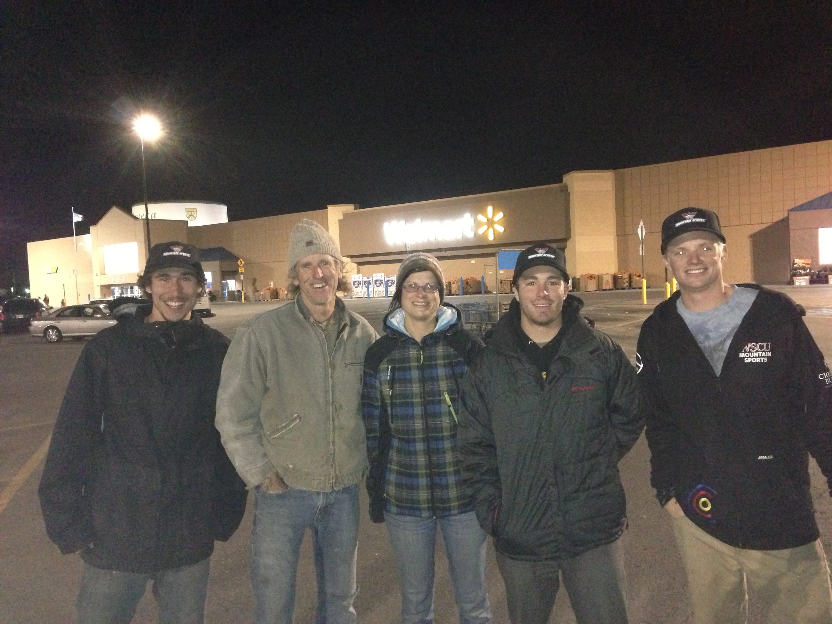 The portrait in front of the Walmart sign.
