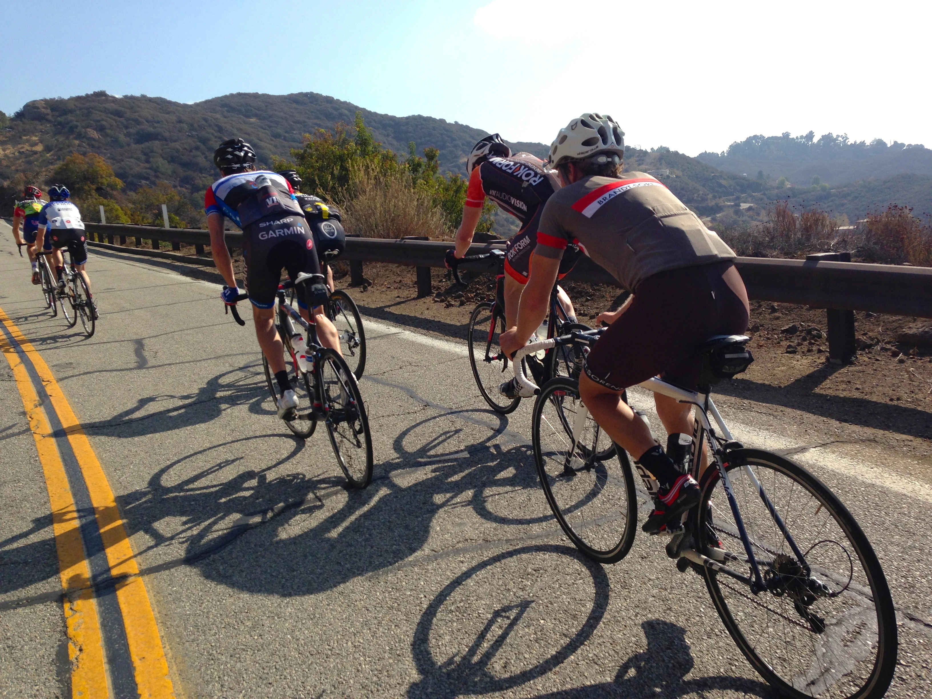 I rode the first half with a smallish group that included Dave Zabriskie. I didn&rsquo;t catch the name of the rider in the brown. He was strong. I really liked his clothing. I&rsquo;d never seen brown shorts before and they looked great. He told me they were locally made. Maybe someone can leave a comment about where exactly they come from.