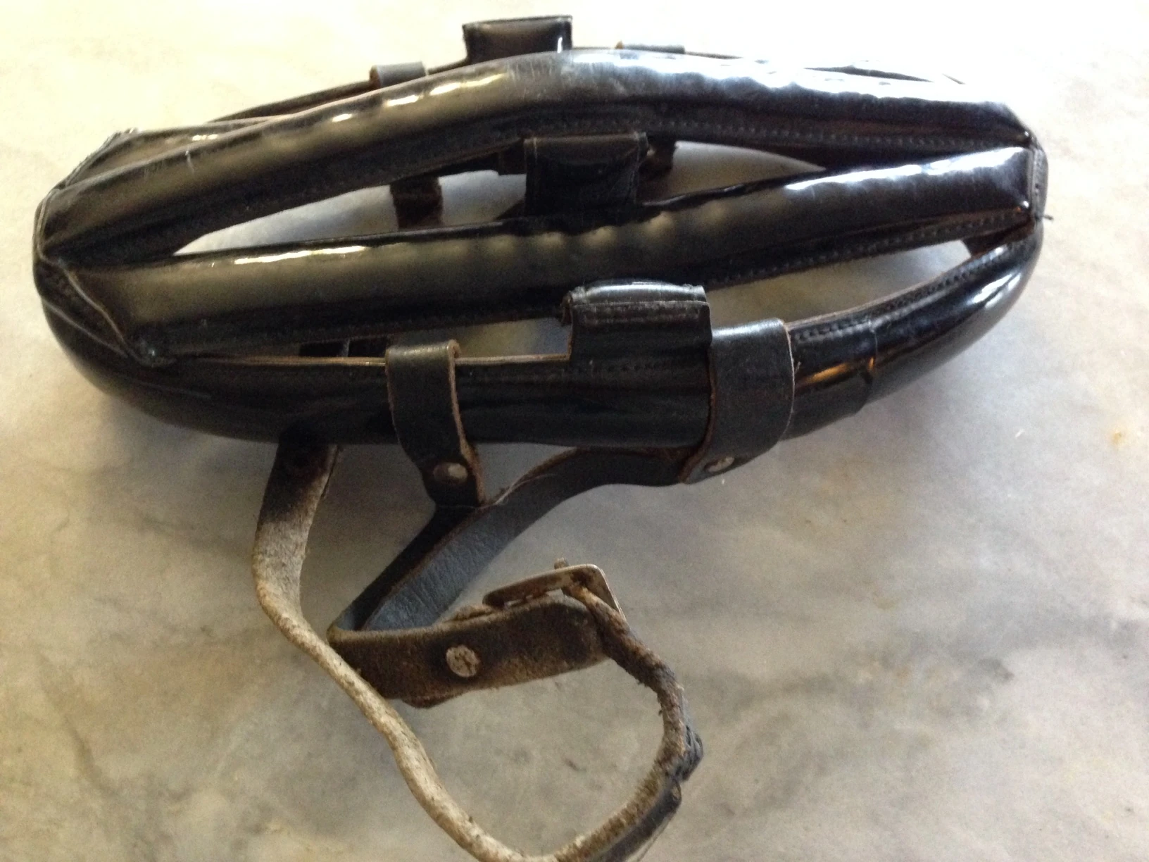 My original patent leather hairnet helmet. It&rsquo;s a little attrified.