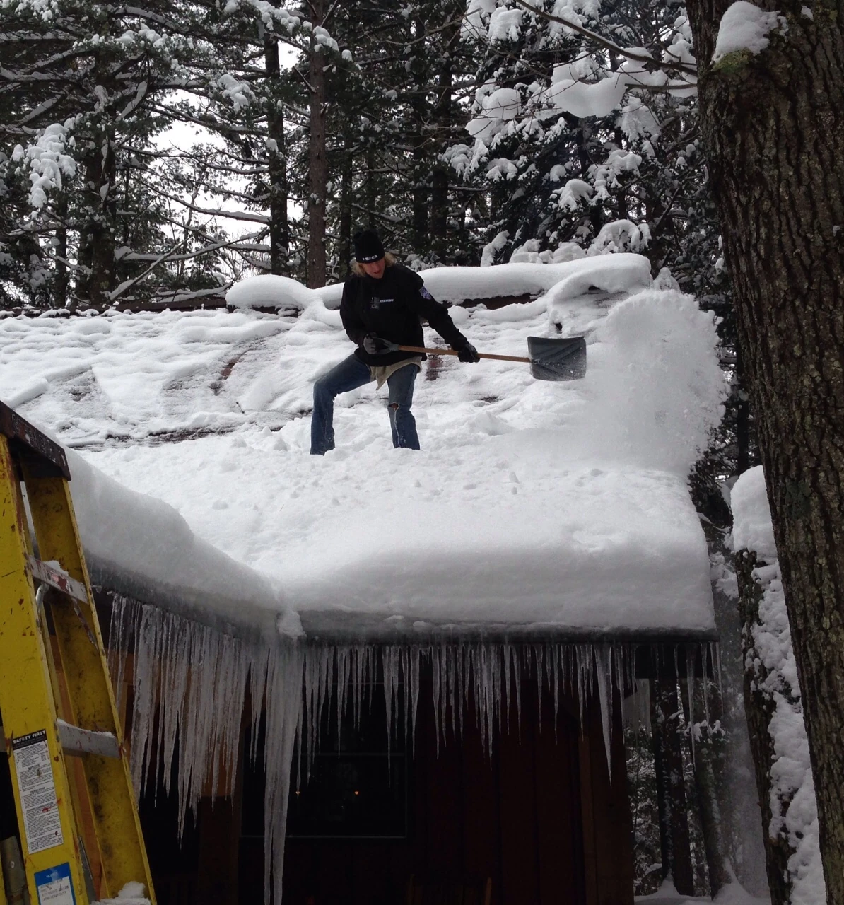 The snow is pretty deep on the roof.