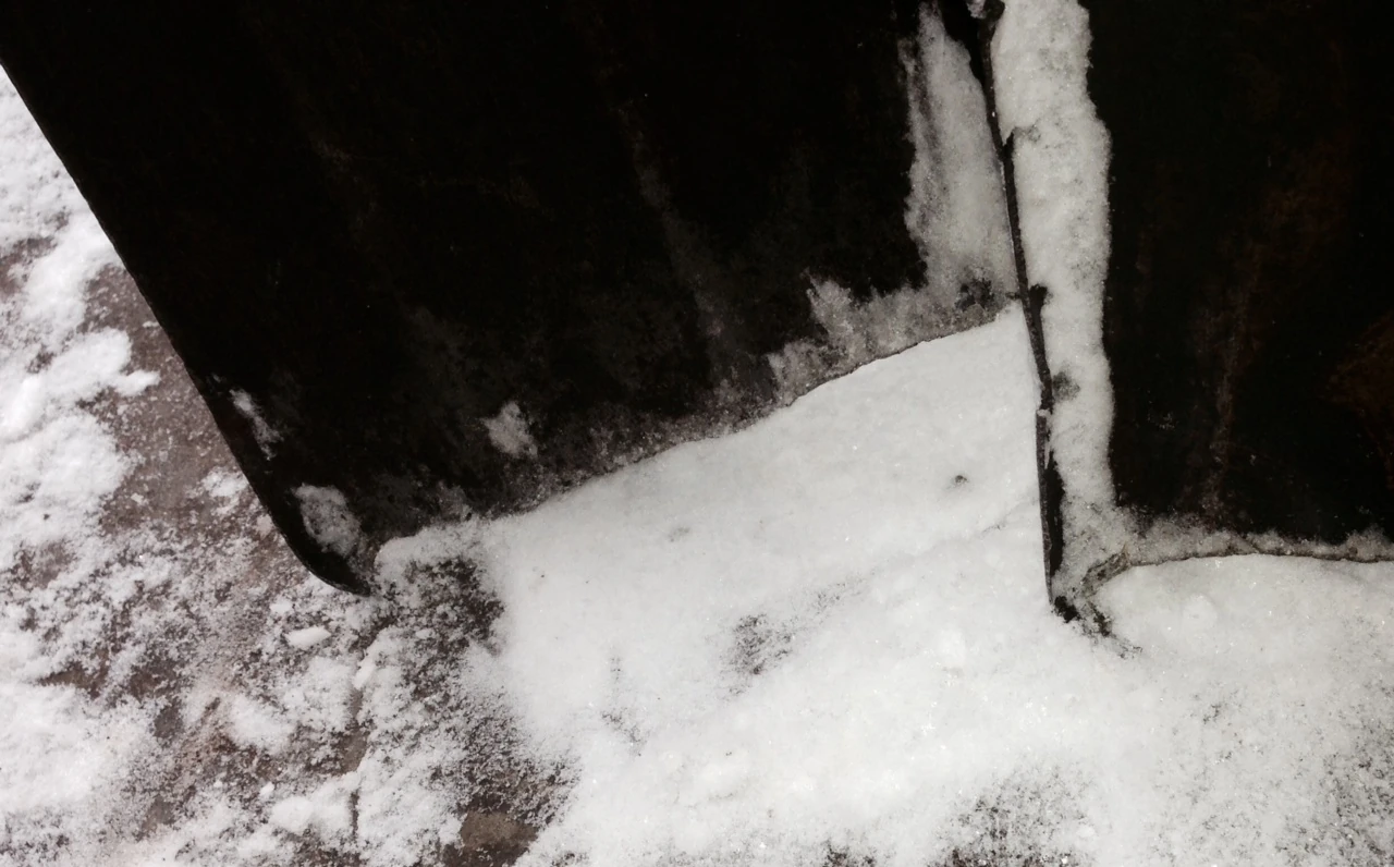 The blades of the steel shovels are curled and short.