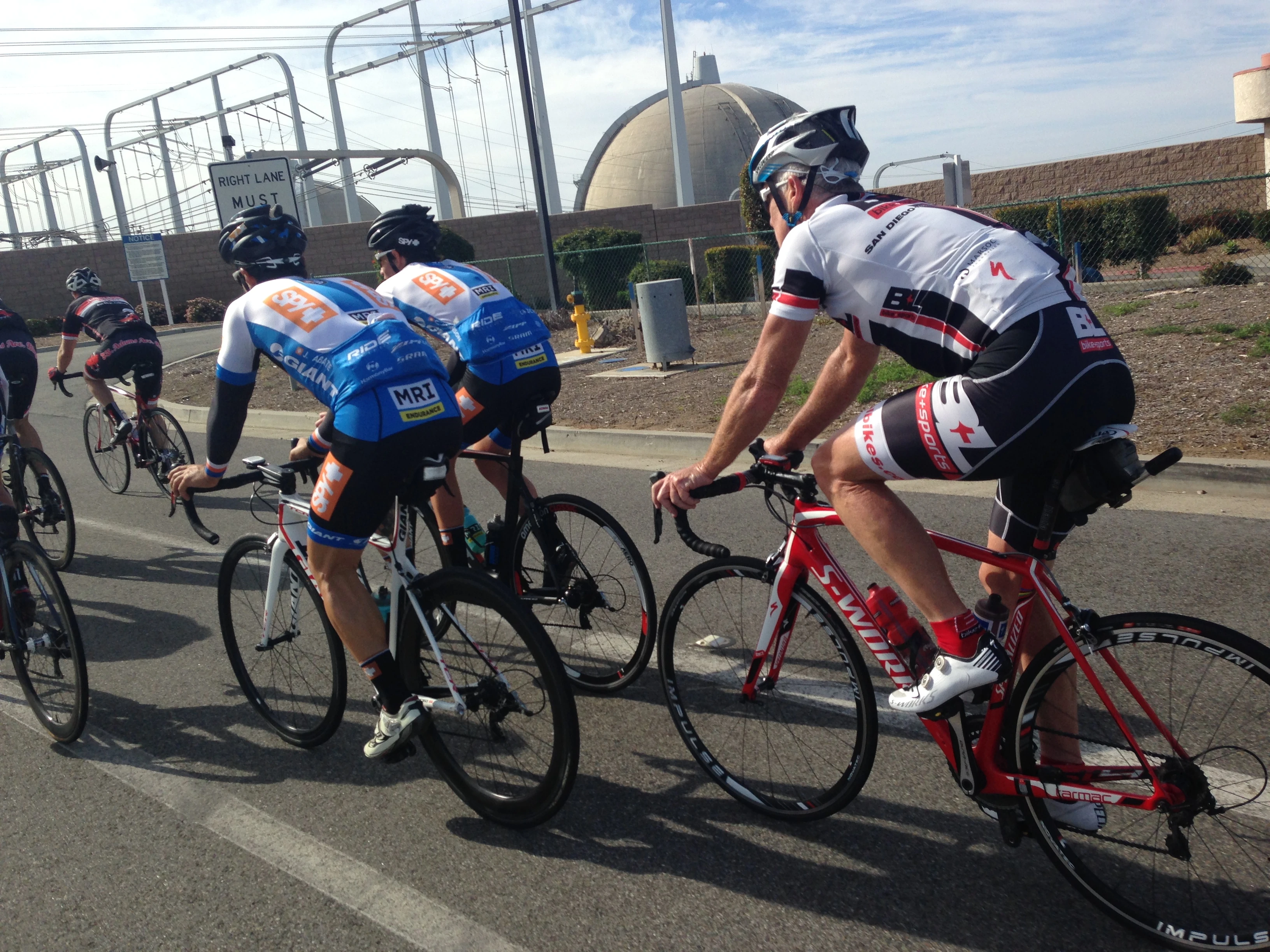 This is Thurlow Rogers riding by the nuclear power plant , San Onofre.