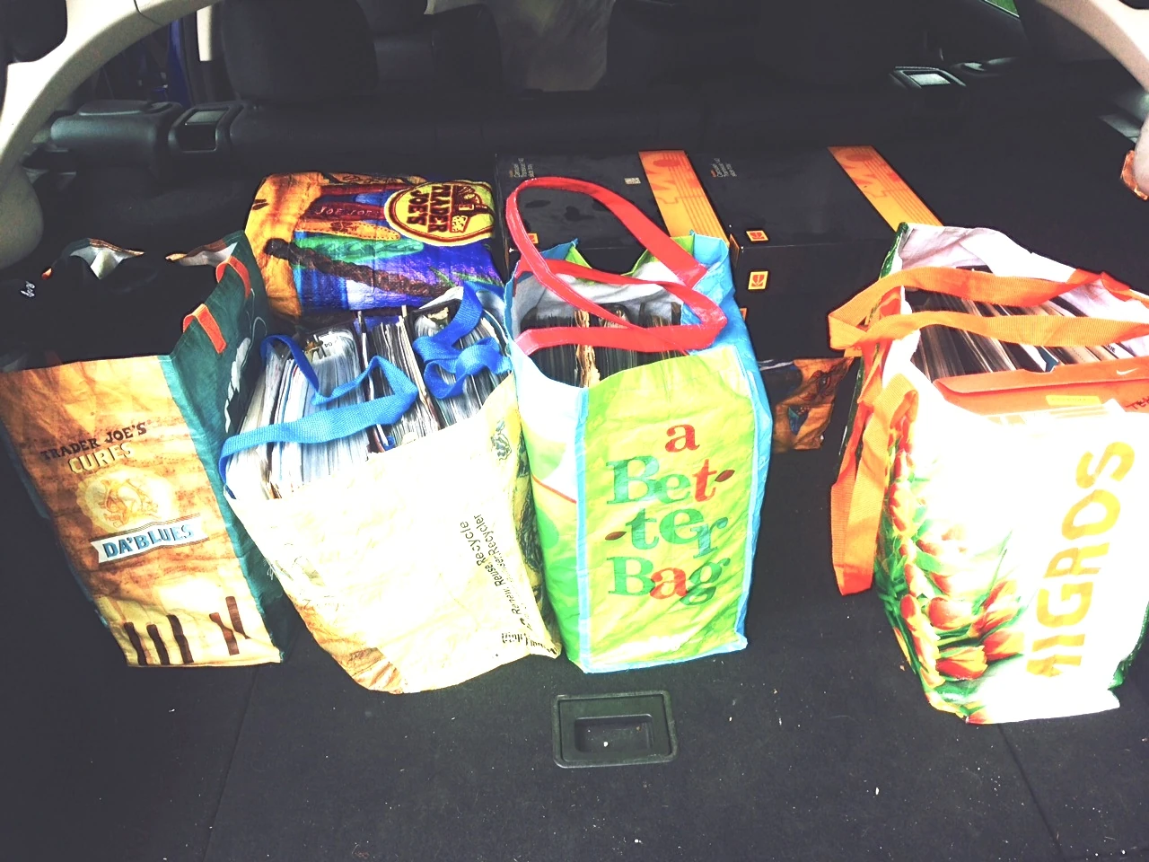 The back of the car loaded up with old articles and slides.