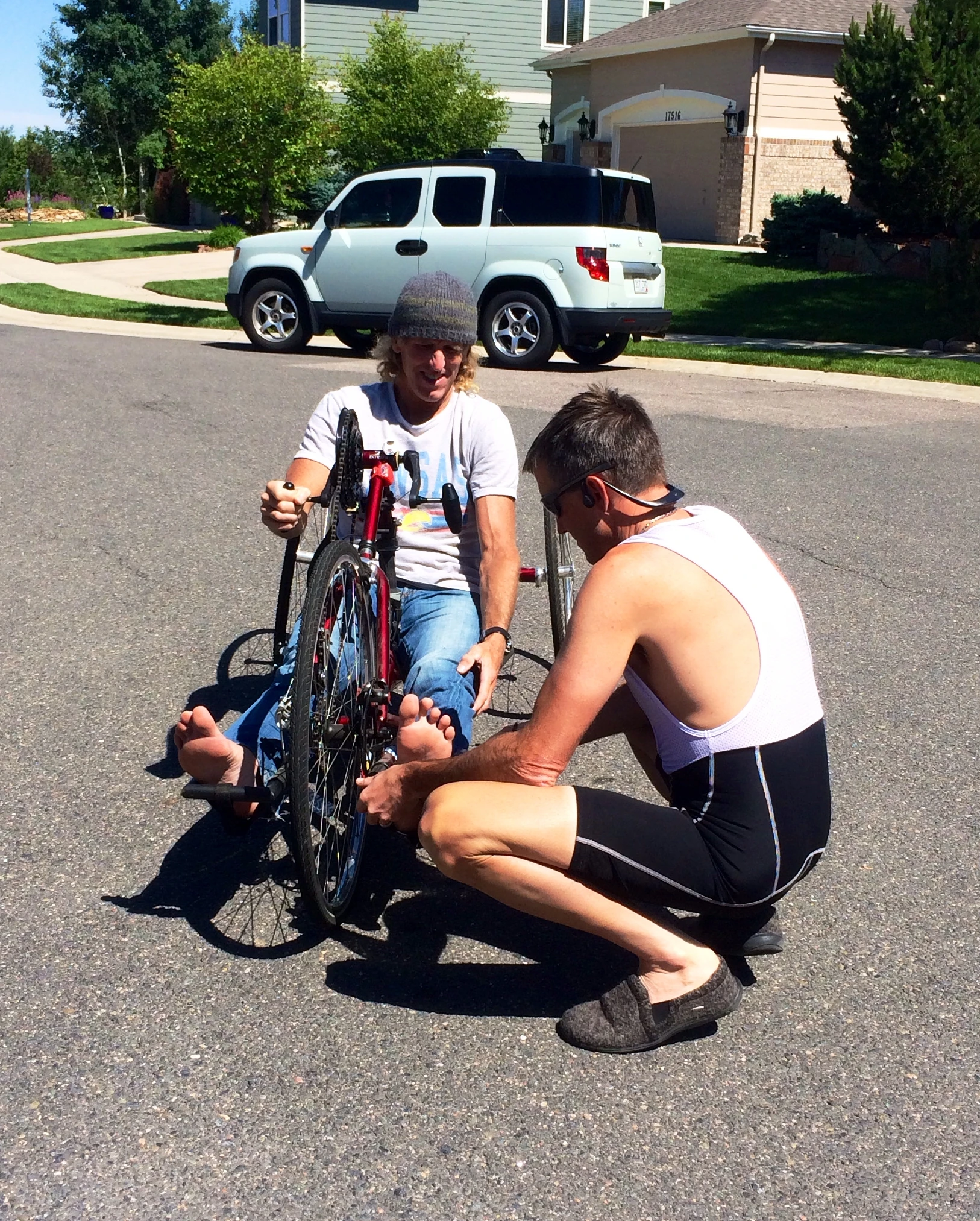 Vincent adjusting the leg reach on the hand cycle