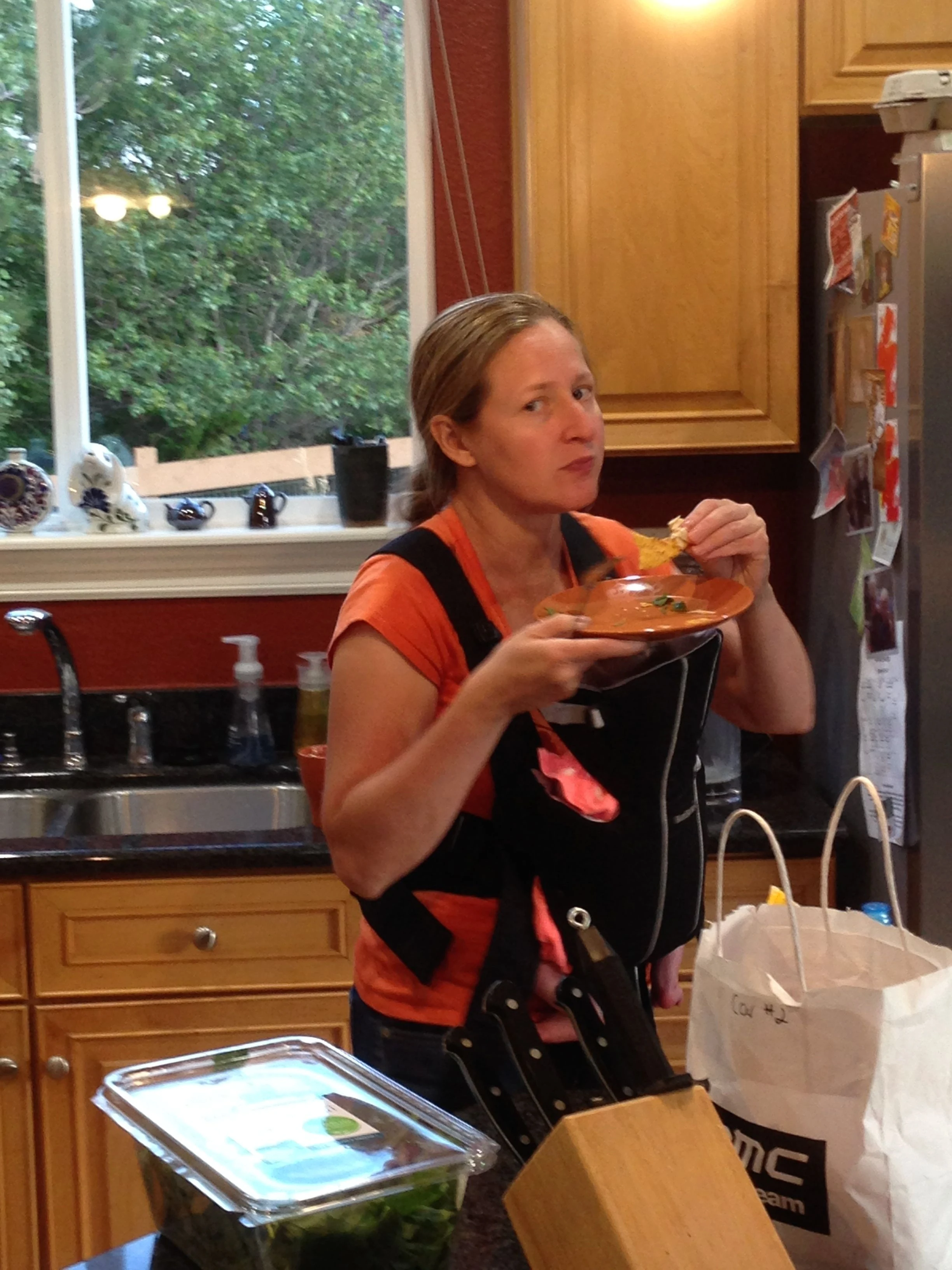 Lisa, giving me the evil eye, while she is bobbing around, trying to get Petra to sleep, while eating. 