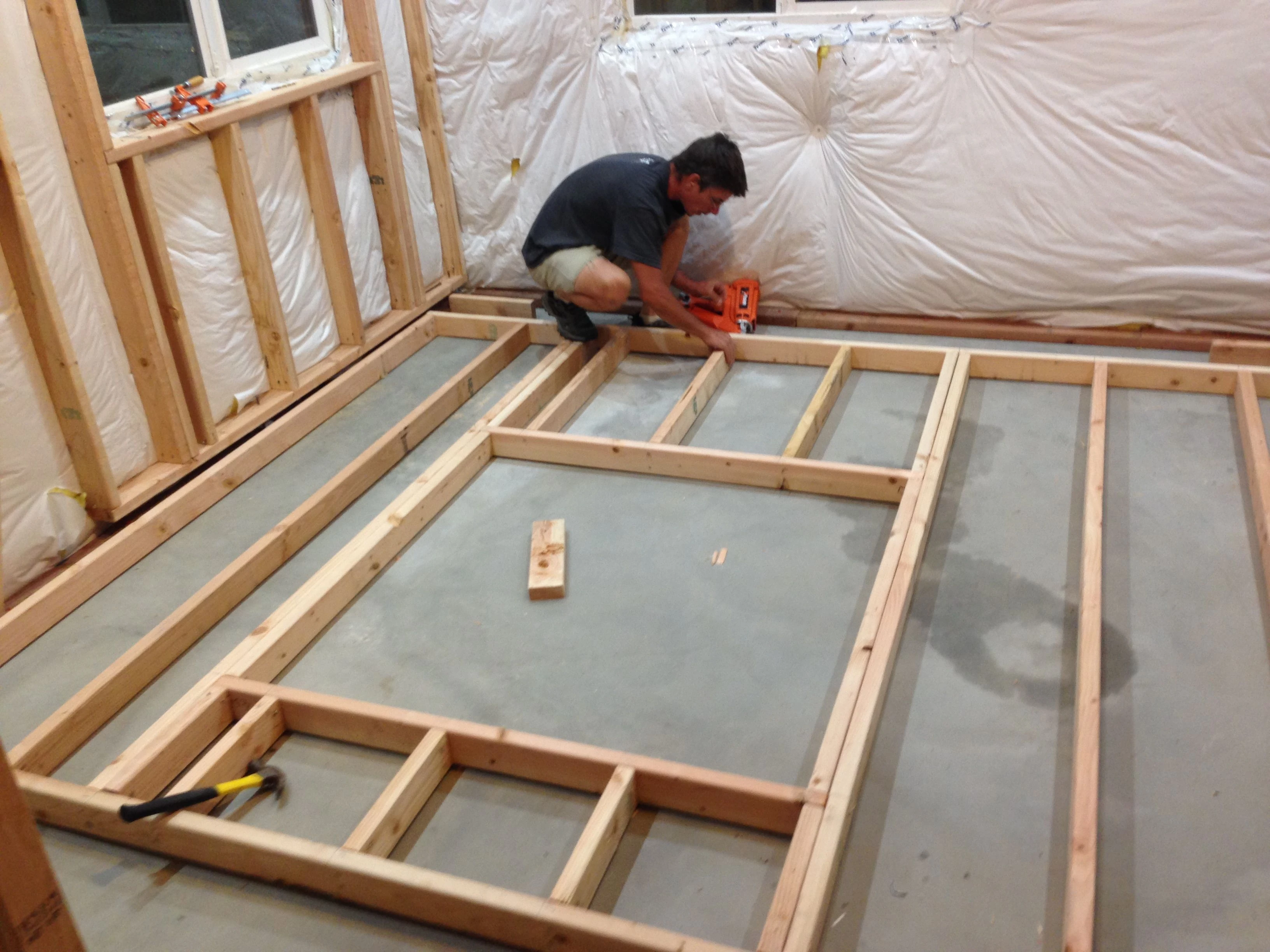 Bill framing a wall. Hanging them from the ceiling is a real hassle. 