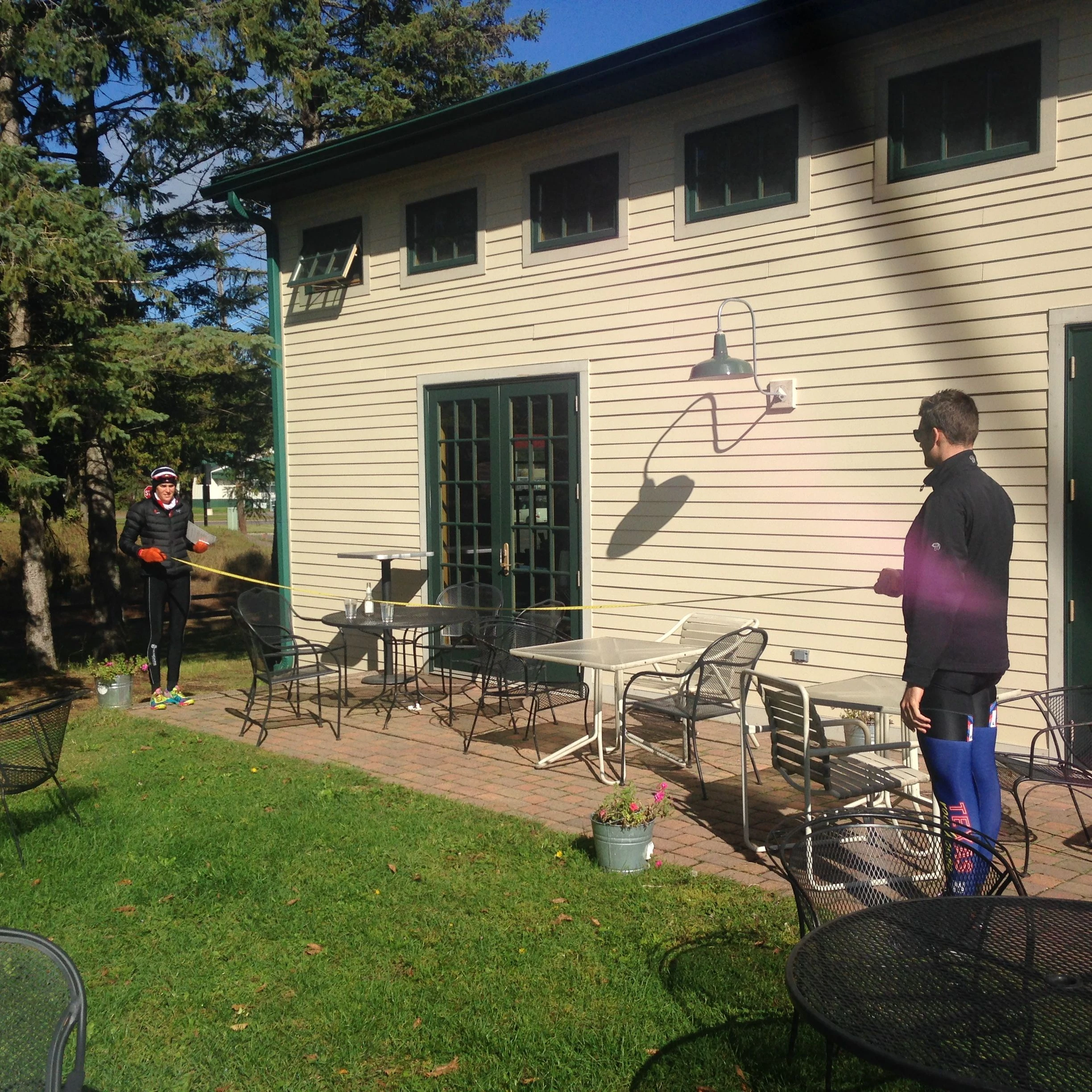 Pat and Gwen measuring for a tent at the Rivers Eatery.