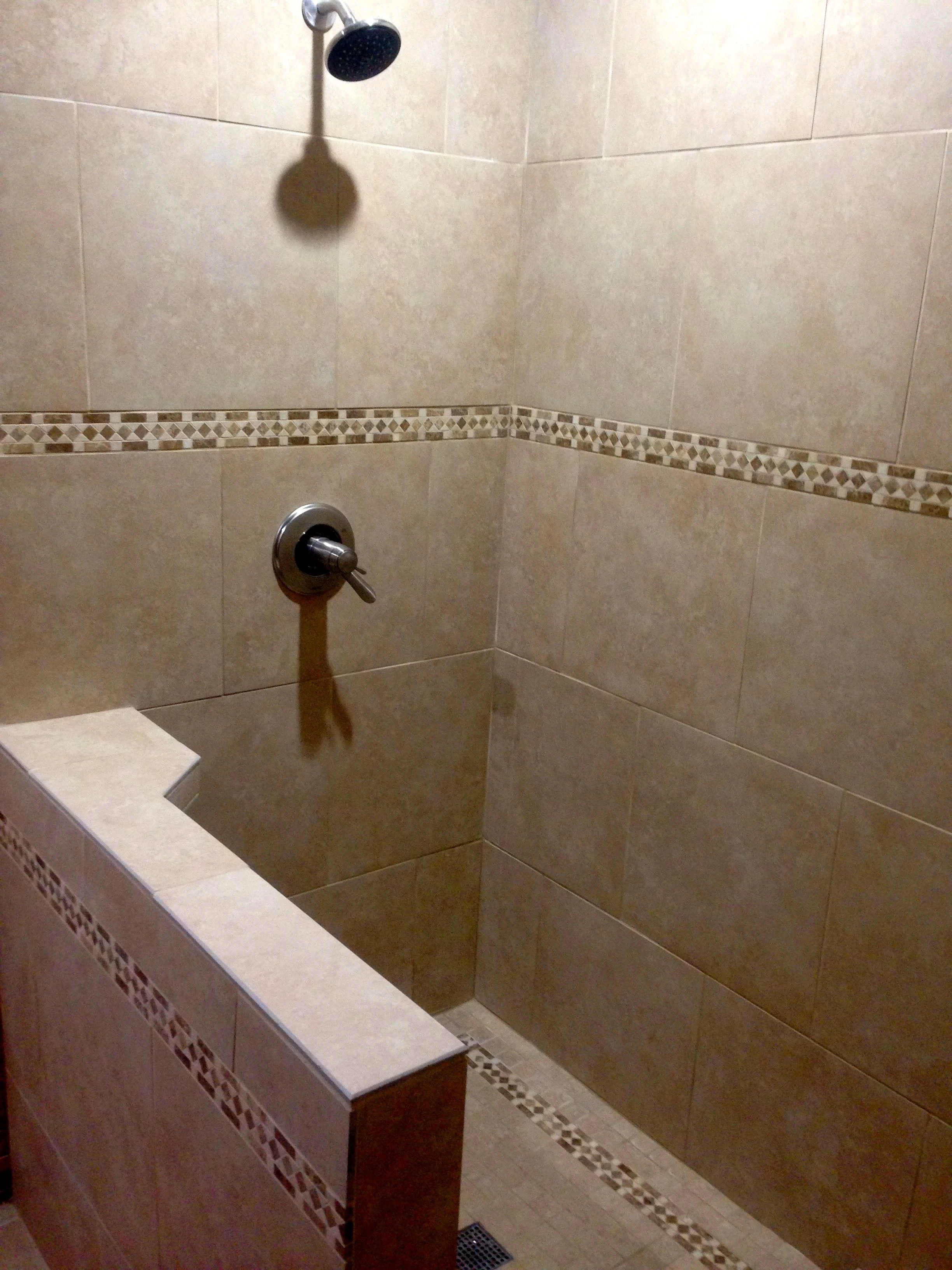 The shower looks pretty good. Vincent is getting a glass wall and shower door custom made for the exposed side.