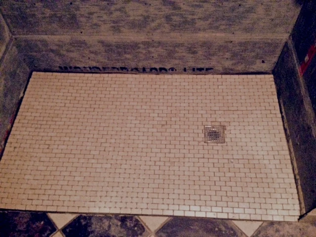 I put in the other floor next to the shower, so felt some connection to the project. The other floor has electric heat and is nice. You can&rsquo;t tell how little slope the shower floor has here. Maybe 1/8" per foot if I&rsquo;m lucky. 