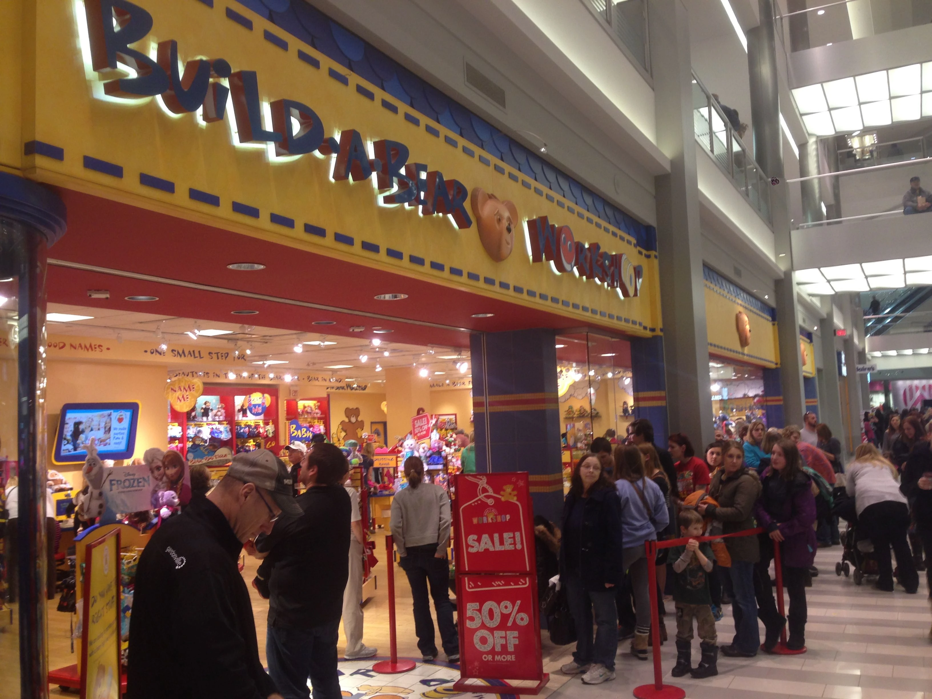 The Mall of America was jammed. This Build-A-Bear place had a super long line. I would like to build a bear there, it looks fun.