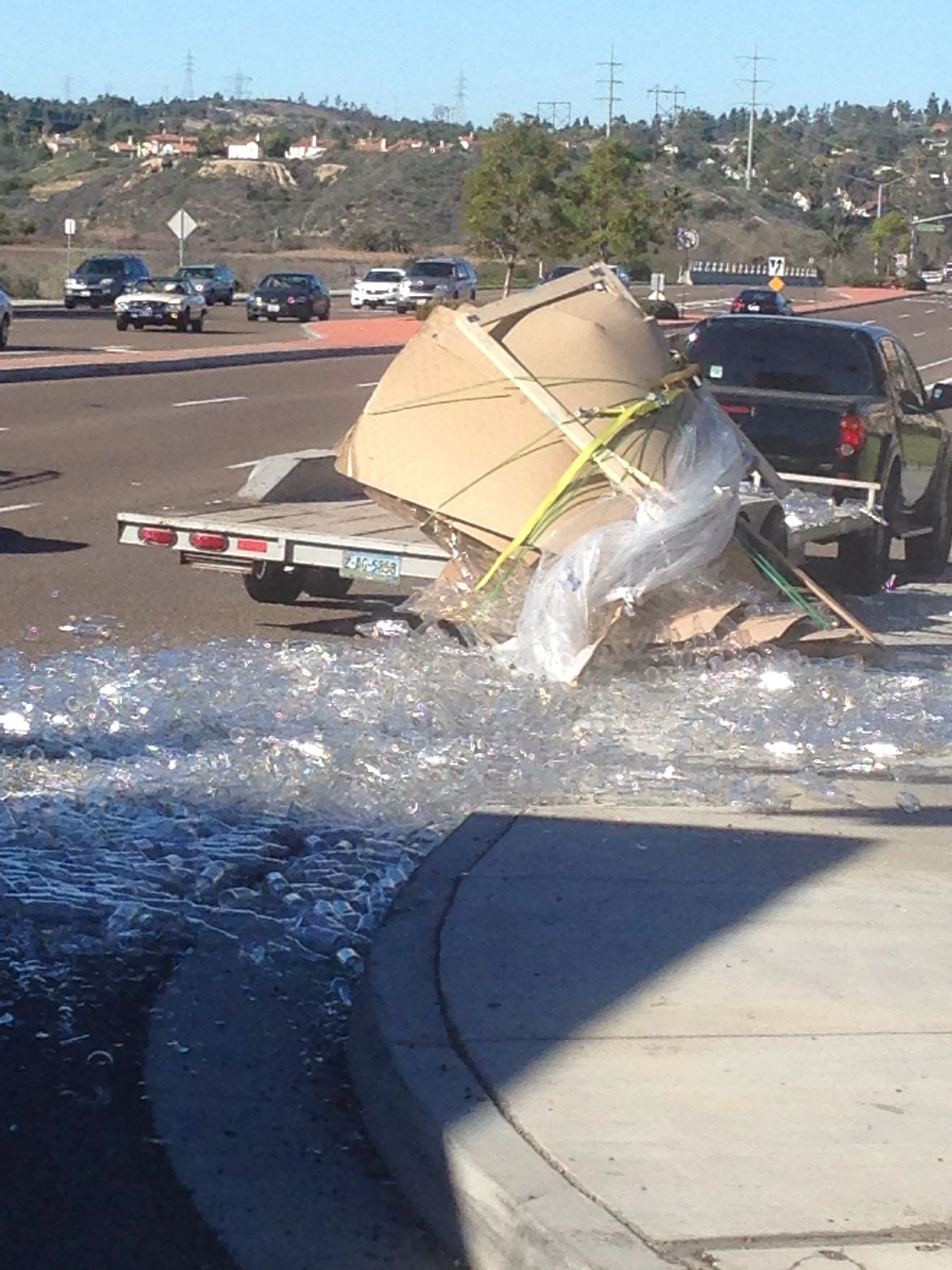 We saw this truck on La Costa dump over a load of bottles. It happened in slow motion.