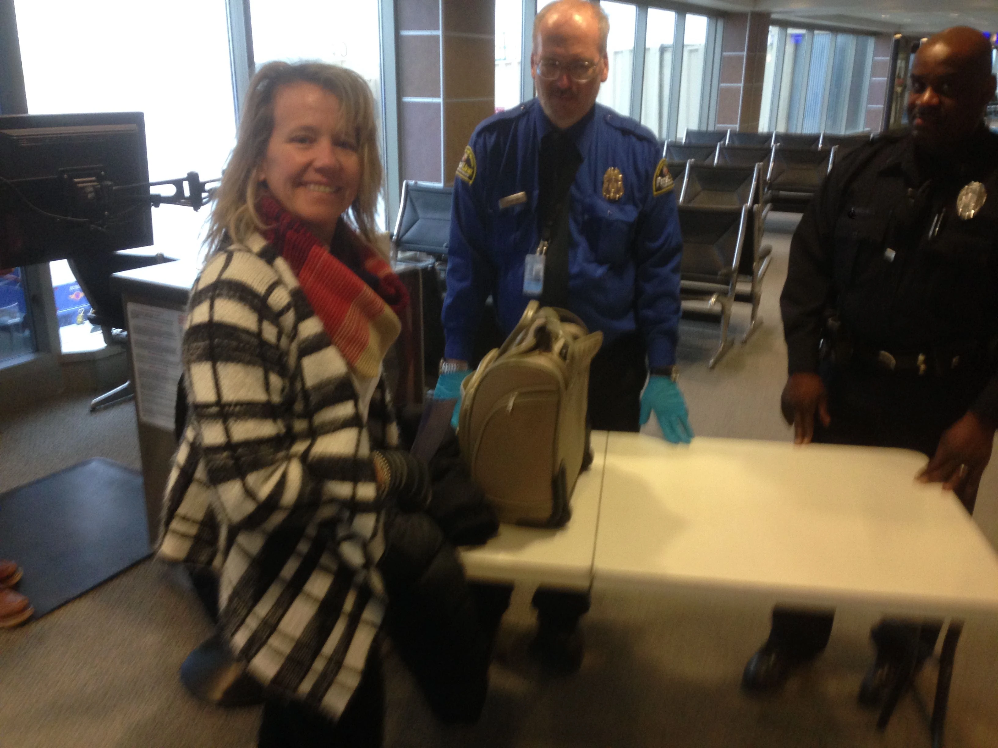 Catherine got random searched at TSA. She seems pretty okay with it.