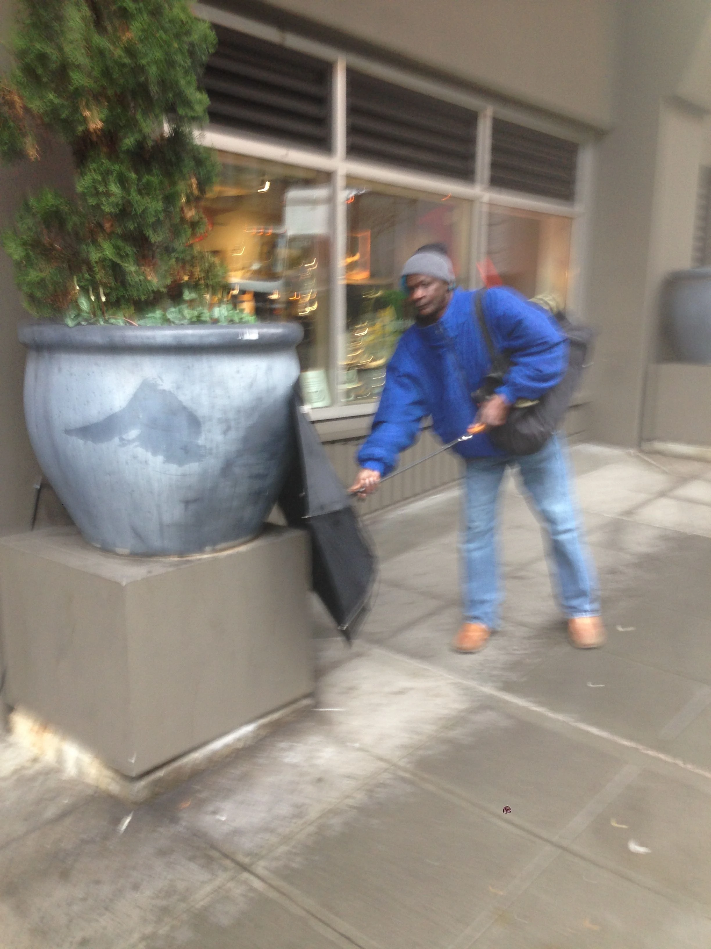 This guy was having a real issue with his umbrella yesterday. 