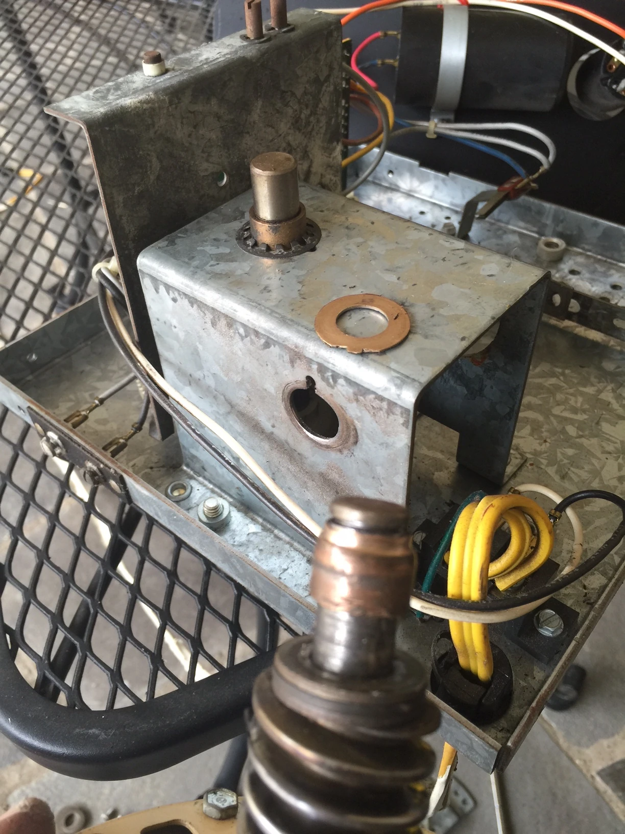 This is the bushing that is worn out. It has a lip on it and it allows the shaft to spin in the metal housing. 