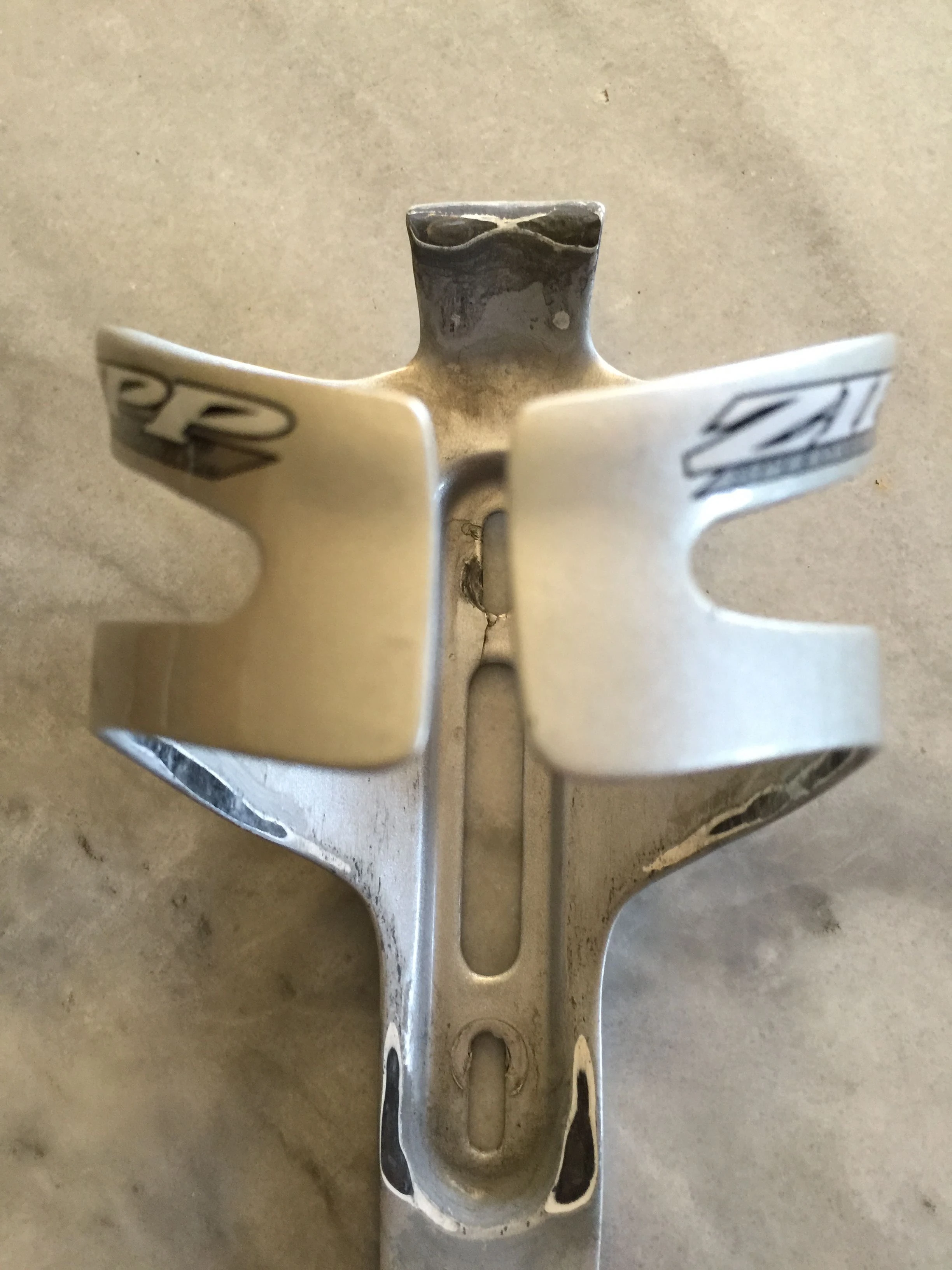 I got this ZIpp cage for my road bike. It weight something like 19 grams, but is valueless. Notice the crack at the top mounting hole. That happened putting it on the first time. Zipp normally makes very good cycling components, but this is an exception. I have two of these and have been meaning to just ship them back to Zipp and tell them they are worth about a penny a gram.