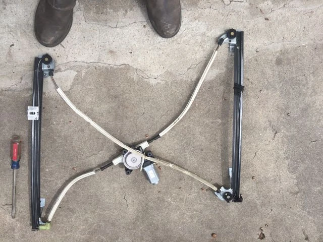 This is the window regulator. It is a little tricky threading it in and out of the door.