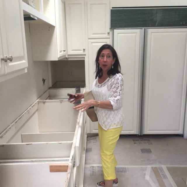 Ann showing me the kitchen in their new house.