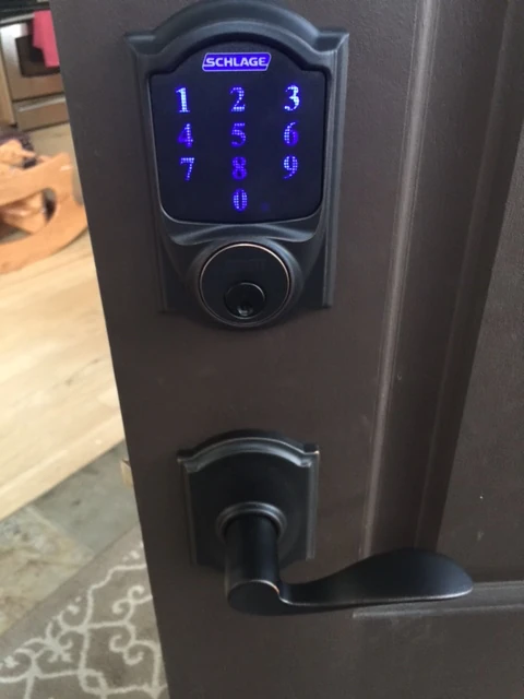 New deadbolt and handle. The deadbolt is connected to the Internet and you can program it to open from your phone.