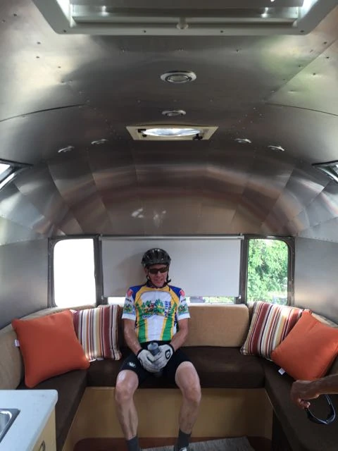 Kent sitting in Brad&rsquo;s Airstream. We stopped at the end of the ride to check it out. It is beautiful inside.