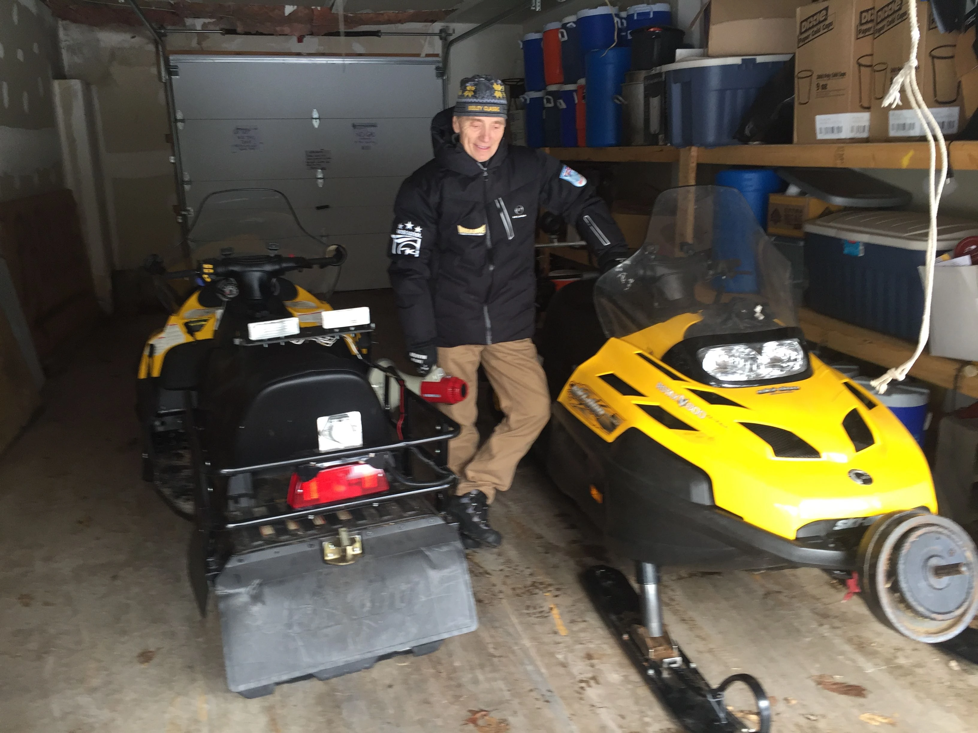 Dennis at the Seeley Ski Club&rsquo;s garage where they keep their snow mobiles.