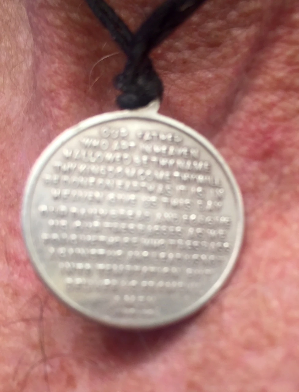 My St. Christopher medal has the Lord&rsquo;s Pray on the back. Pretty small writing. 
