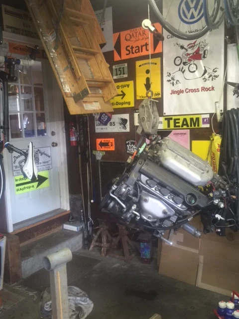 I just used a come along to winch the engine up to put it on the engine stand to work on it.