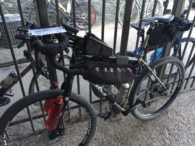 So many different bikes. This is Corey “Cornbread” Godfrey&rsquo;s machine. He has $20 of pennies in the frame bag. He&rsquo;s training for the Great Divide race. No thanks. 