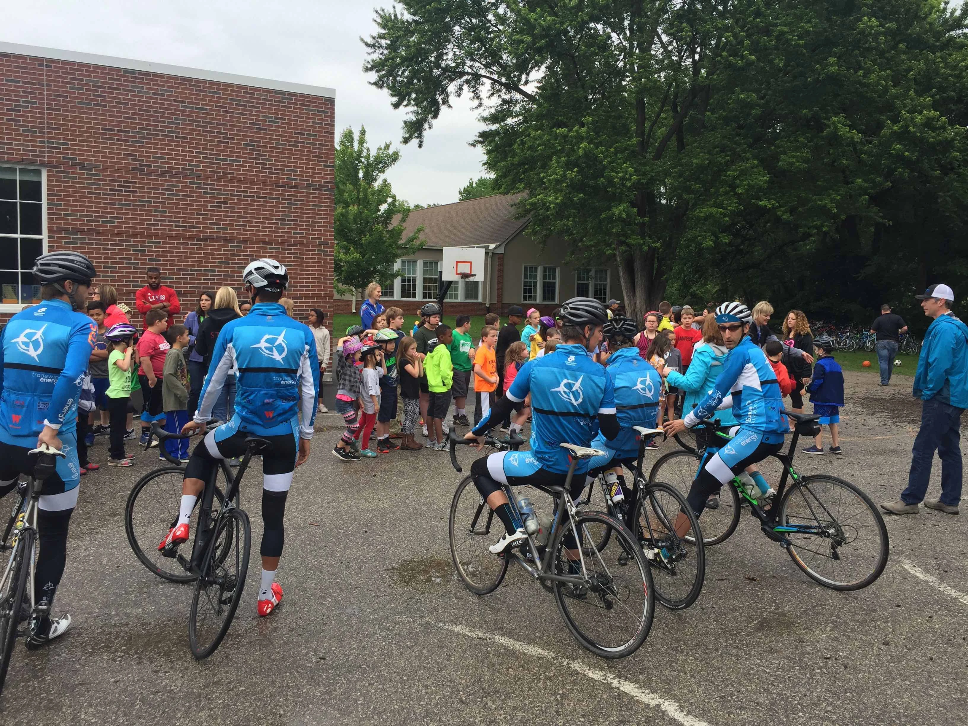 The guys talking to the kids.