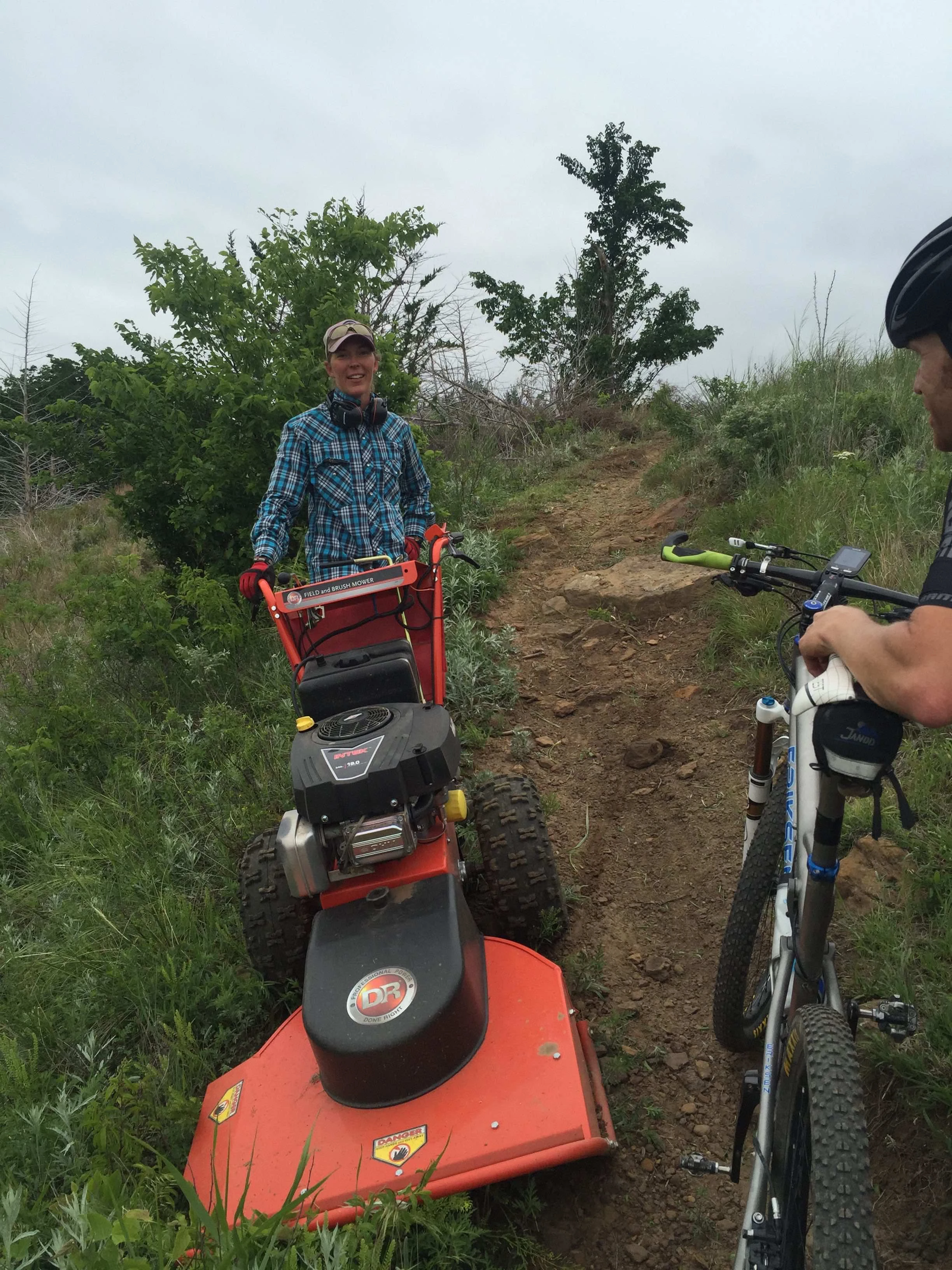 This is Sara K. I&rsquo;m not sure if she spells her name with an h or not. Anyway, she was running this down the trail. It was so hard to ride and she was &ldquo;man-handling&rdquo; this brushhog deal. She must be crazy strong. She said she had been at it 4 hours. Amazing.