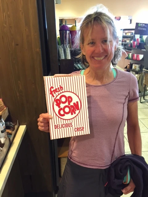 Catherine bought salty popcorn while were were stopping for coffee.