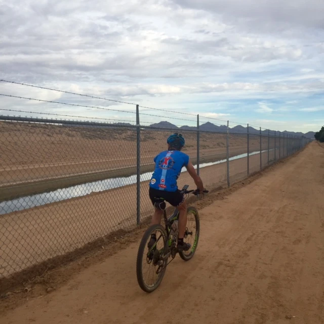Vincent riding back to the car dealership. They really protect their water down here.