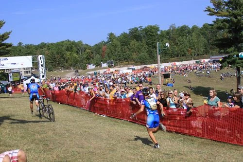 My friends, Kim and Brian Eppen, demonstrating just another reason not to ride/run a tandem in a MTB race. You can tell Brian isn&rsquo;t much for waiting.