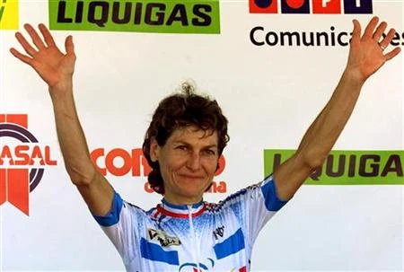 French cyclist Jeannie Longo-Ciprelli waves on the podium after the elite women's time trial 2001 Wo..