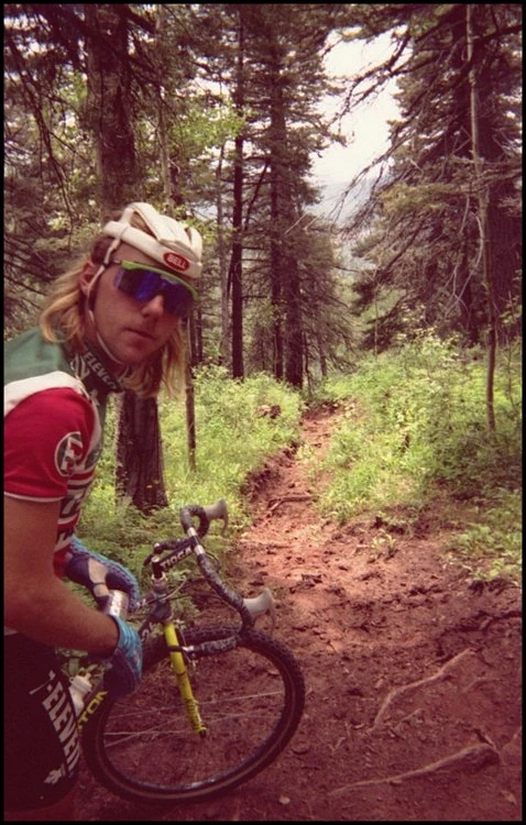 And this is John Tomac, riding his dropped bar MTB bike, all shaggy and stylish. 