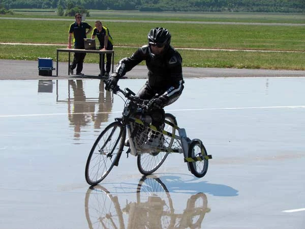 Michlein patented this to test the grip capacity of their tires in the wet. I would like this job. I could give them some pointers about corning in the wet. This picture makes it look like they could use some help.