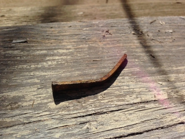 The nails that hold the hardwood flooring down are square.