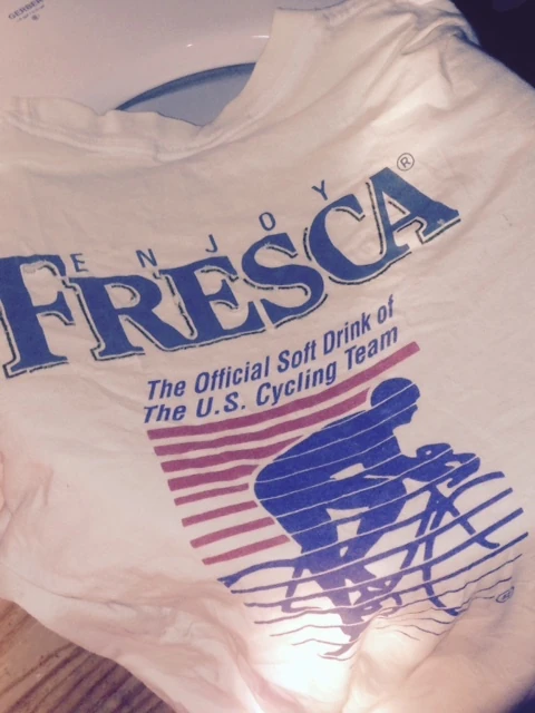 I found this old t-shirt in the grout cleaning rag pile. Fresca for cycling, yum.