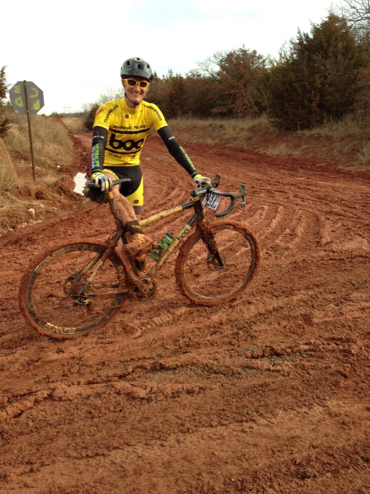 This is Nick Frey, founder of Boo Cycles, all clogged up. He came a long way from Colorado to be bogged down in this red muck. I know, by personal experience, how ugly Oklahoma mud can be.