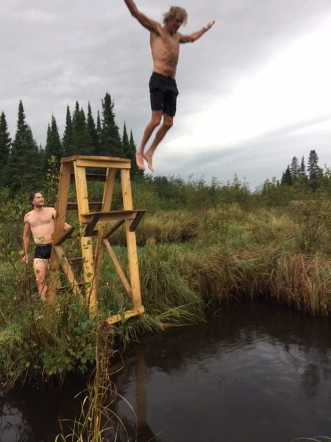 Taking the plunge, in the swamp, after the wood fired sauna.